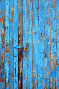 Full frame shot of weathered blue door