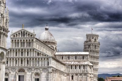 Low angle view of building against cloudy sky