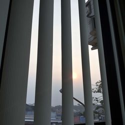 Low angle view of illuminated building against sky during sunset