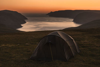 Tener with view of sea against sky during sunset