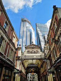 Low angle view of buildings in city against sky