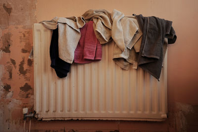 Close-up of towels drying against wall