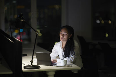 Woman working late in office