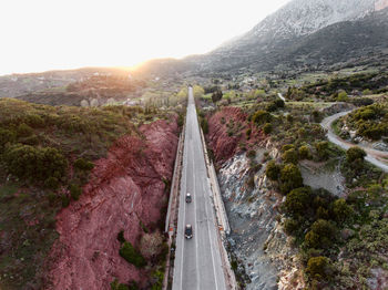 Panoramic shot of road amidst plants against sky