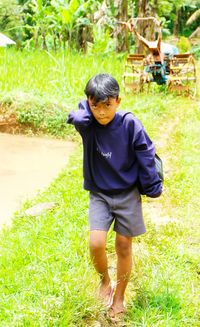 Boy standing on field