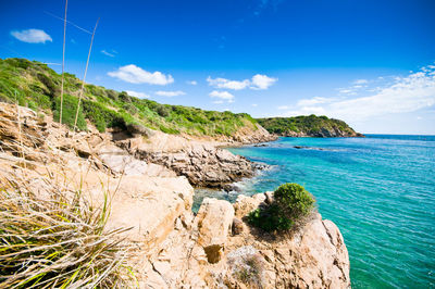 Scenic view of sea against blue sky