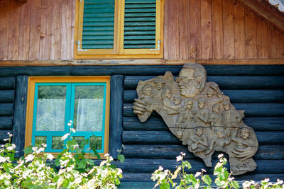 Close-up of statue against building