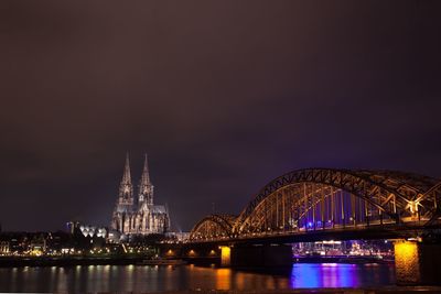 Bridge over river at night