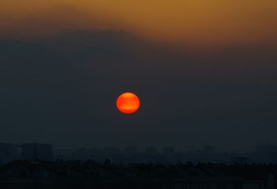 Scenic view of moon against sky during sunset