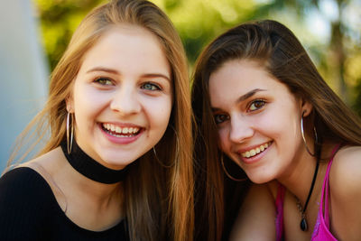 Close-up of cheerful young women