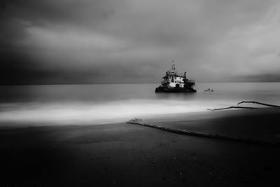 Boat in sea against sky