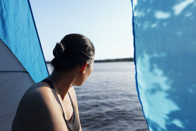 Rear view of woman in boat