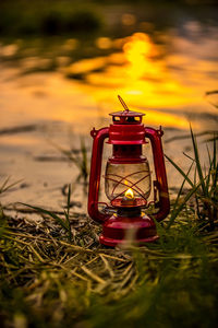 Close-up of red lantern on field