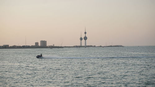 Scenic view of sea against clear sky during sunset