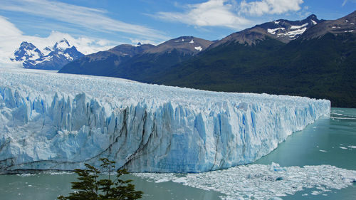 Scenic view of lake against mountain range