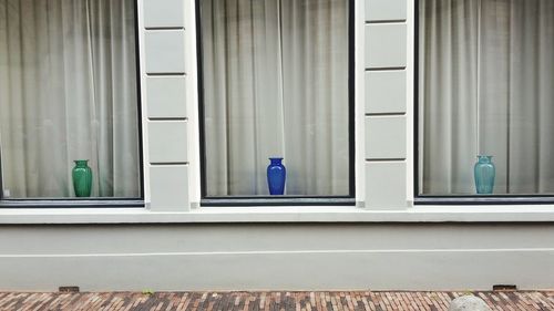 People walking by door of building