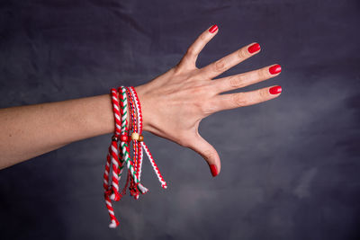 High angle view of woman hand on red background