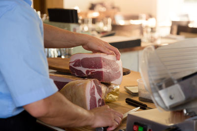 Midsection of man preparing food at home