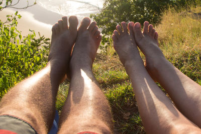 Low section of man relaxing outdoors