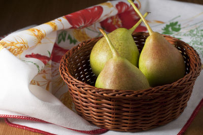 High angle view of apples in basket on table