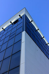 Low angle view of office building against clear sky