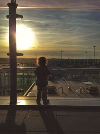 Silhouette of woman at sunset
