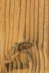 Full frame shot of carving on sand