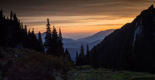 Scenic view of mountains against sky during sunset