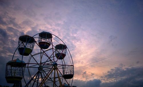 Low angle view of ferris wheel against sky