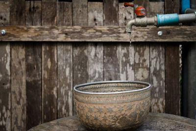 Close-up of old pipe against wall