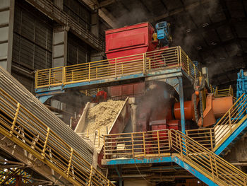 Rear view of man standing in factory