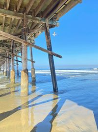 Pier over sea against sky