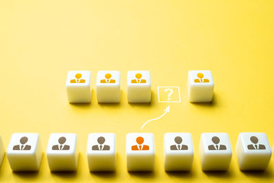 Close-up of toy blocks on yellow background
