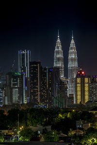 Illuminated buildings in city at night
