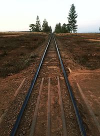 Railroad tracks against clear sky