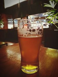 Close-up of beer glass on table