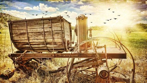 Abandoned barn on field against sky