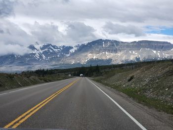 Empty road against sky