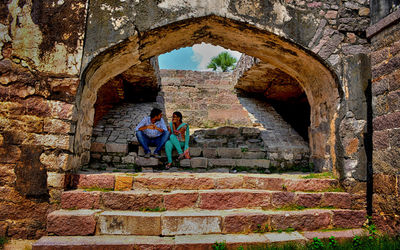 People in old ruins