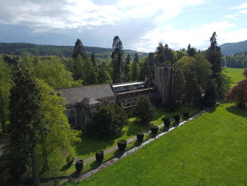 Panoramic shot of trees and buildings against sky