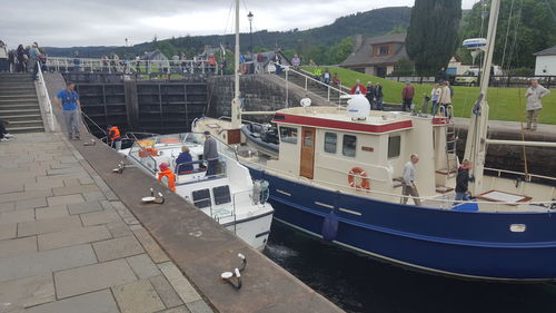 Boats moored at harbor