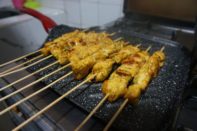 High angle view of meat on barbecue grill