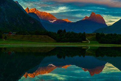 Scenic view of lake and mountains against sky