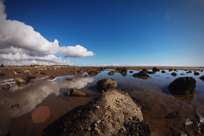 Scenic view of sea against blue sky