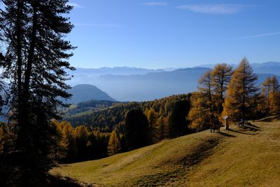 Scenic view of landscape and mountains against sky