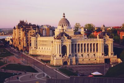 Historical buildings in city against clear sky