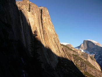 Low angle view of rock formation against sky