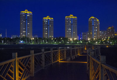 Illuminated city buildings at night