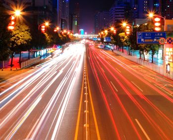 Illuminated city street at night