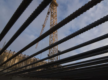 Construction crane in building industry, heavy machine at construction site